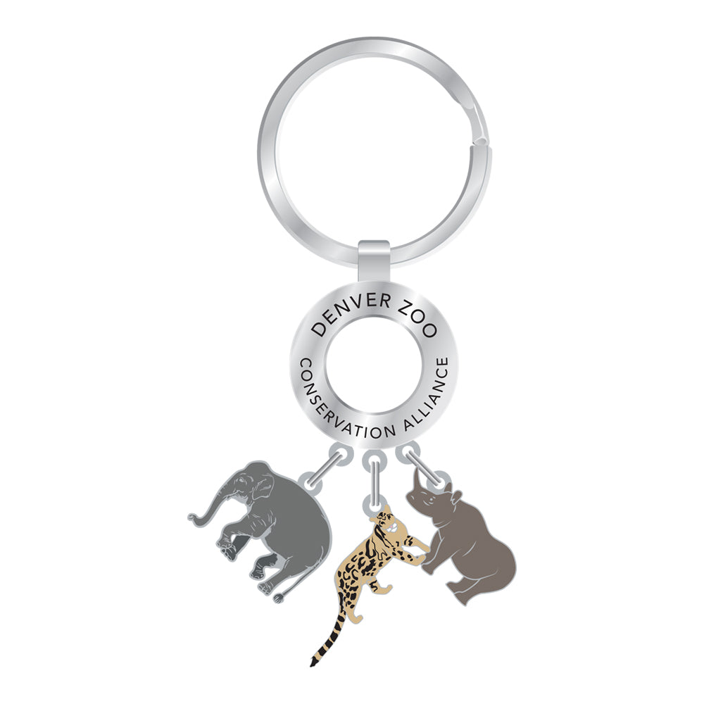 The DZCA Elephant/Rhino/Leopard Keychain features silver animal charms—an elephant, rhinoceros, and leopard—with "DENVER ZOO CONSERVATION ALLIANCE" engraved on the ring. Ideal for wildlife lovers and zoo enthusiasts.