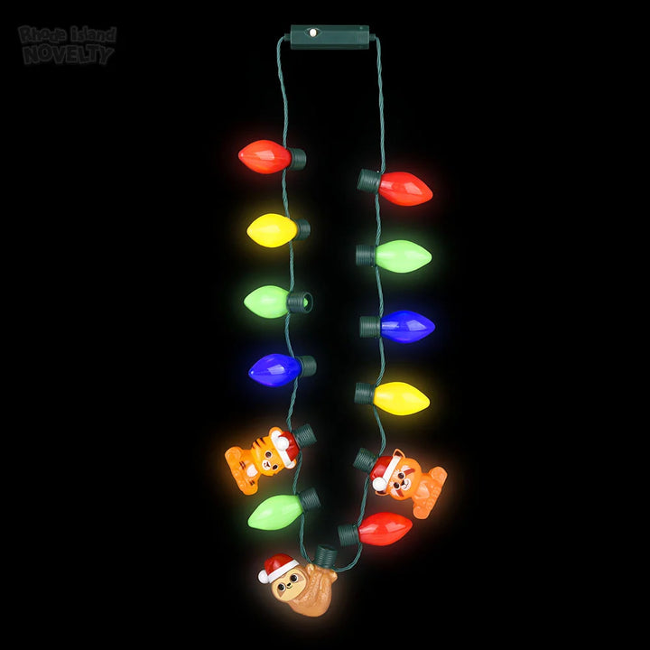 LED Zoo Bulb Lanyard consisting of colorful, glowing bulb-shaped lights interspersed with three plastic animal figures wearing Santa hats.