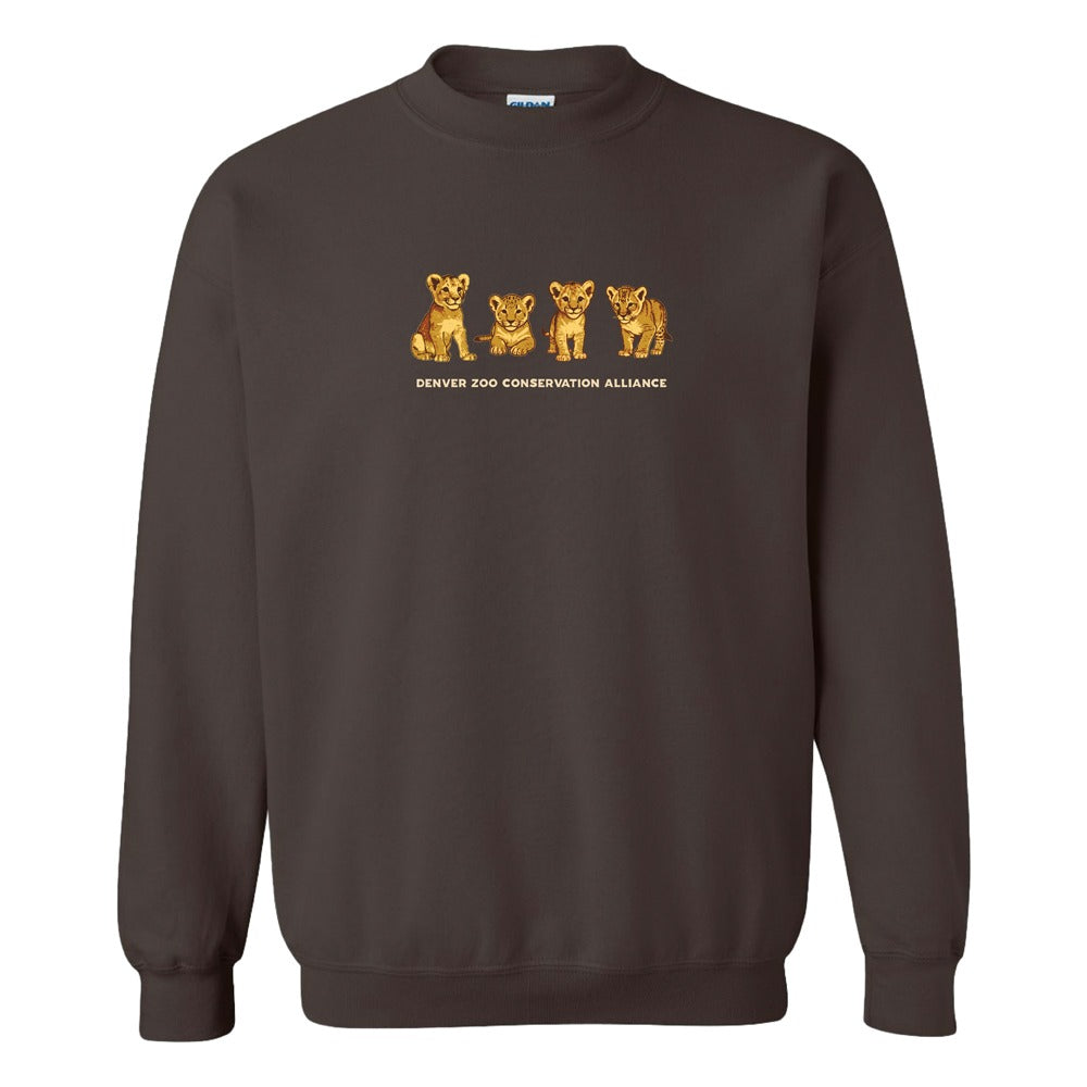 The DZCA Lion Cub Embroidered Crew Sweatshirt is a brown top with four lion cubs and "Denver Zoo Conservation Alliance" text—ideal for wildlife fans and African lion conservation supporters.