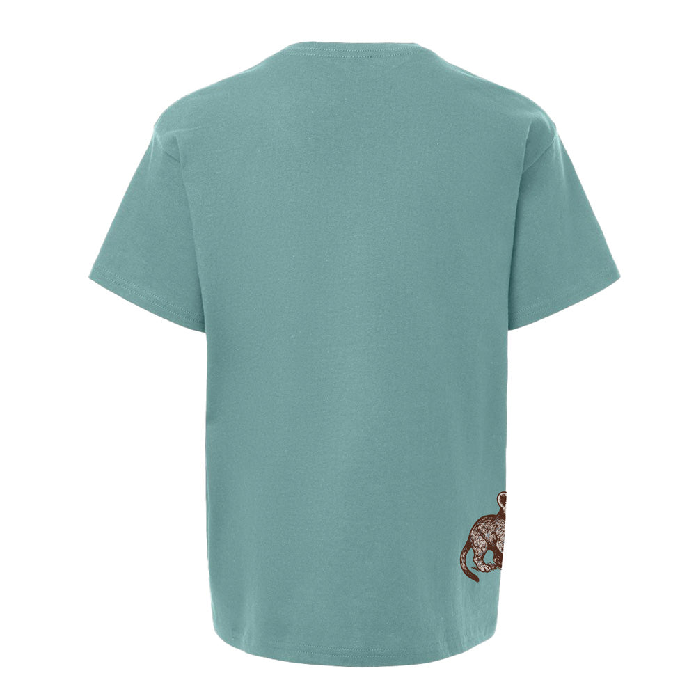 A light blue DZCA Lion Cub Youth T-Shirt shown from the back features a small, detailed illustration of a brown monkey near the bottom right corner.
