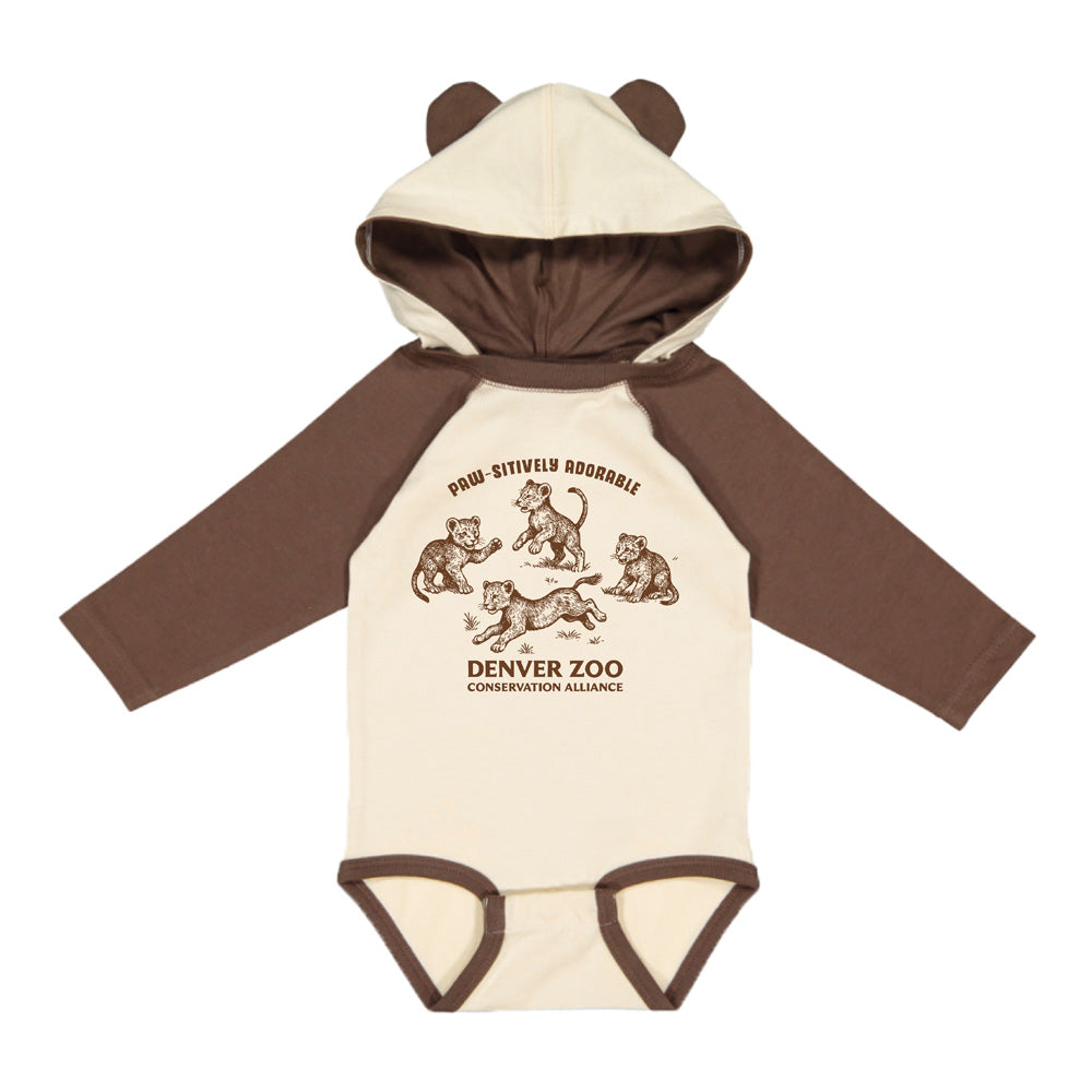 A beige and brown DZCA Lion Cub Hooded Infant Onesie with long sleeves and cute bear ears on the hood. Features animal illustrations on the front and “PAW-SITIVELY ADOORABLE DENVER ZOO CONSERVATION ALLIANCE” text.
