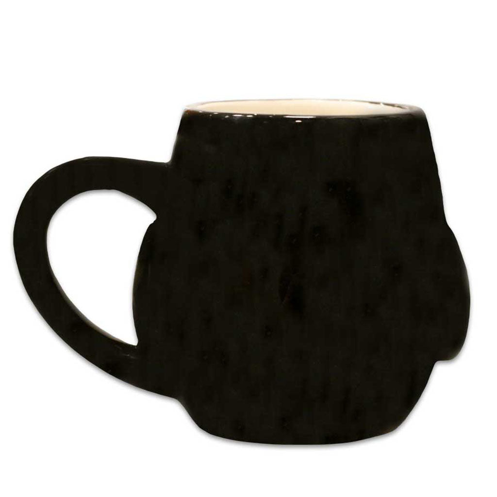 The Penguin 3D Mug is a black ceramic mug with a glossy finish, beige interior, large handle shaped like a clenched fist, and sculptural design. This eye-catching piece is showcased on a plain white background.