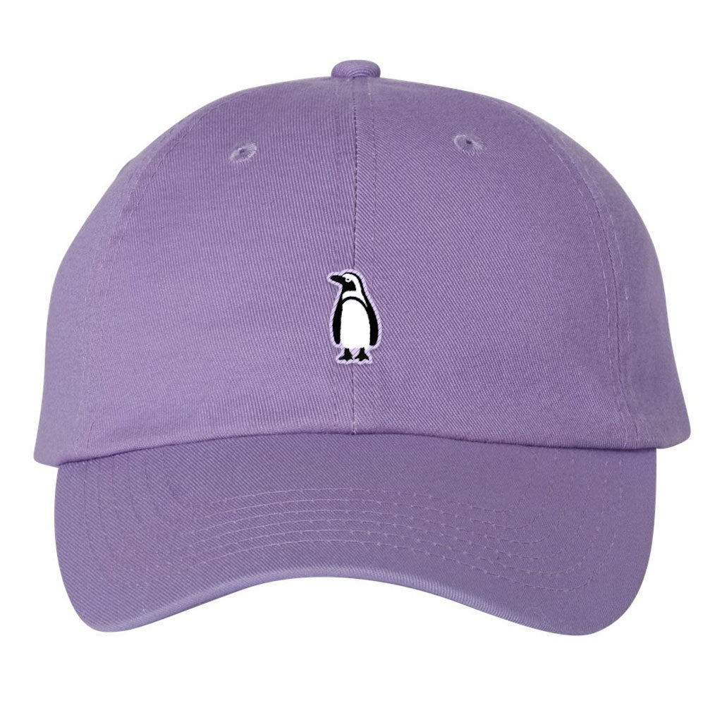 The Penguin Icon Embroidered Cap features a lavender color and a small black and white penguin logo on the front, making it an ideal accessory for wildlife enthusiasts.