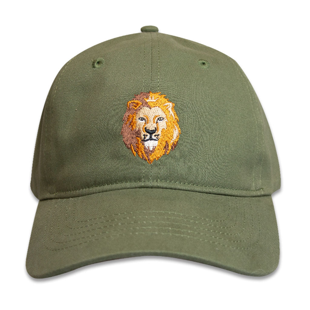 The Lion Icon Embroidered Cap is an olive green cotton hat with a yellow and brown lion’s head embroidered on the front, a curved brim, and ventilation holes—ideal for wildlife enthusiasts.