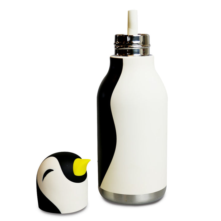 The Penguin Water Bottle, with a black and white design and a penguin-shaped cap featuring a yellow beak, sits next to the leakproof water bottle equipped with a top straw for spill-free sipping.