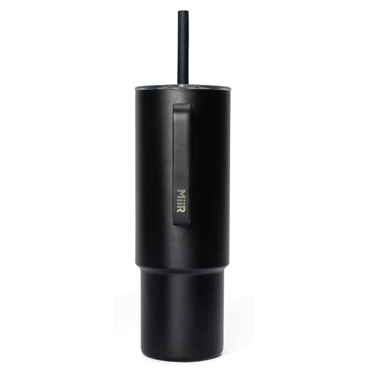 A black stainless steel DZCA Logo Straw Tumbler, 32 oz, with handle, lid, and straw stands upright against a plain white background. The brand name appears in silver letters on the side.