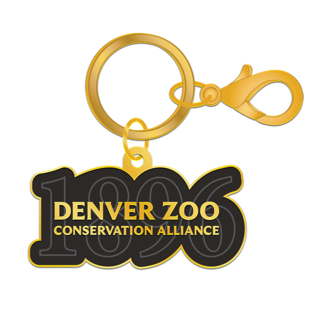 The DZCA 1896 Keychain is a gold keychain with a black tag featuring “1896” in large numbers and “DENVER ZOO CONSERVATION ALLIANCE” in bold yellow, ideal for Denver Zoo and Conservation Alliance supporters.
