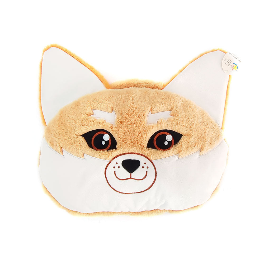 The Fennec Fox Plush Bag Blanket Combo is shaped like a fox’s face with orange-brown fur, white cheeks, upright ears, embroidered eyes, and a smiling mouth. It’s perfect for kids’ room decor and comes with a tag attached to one ear.