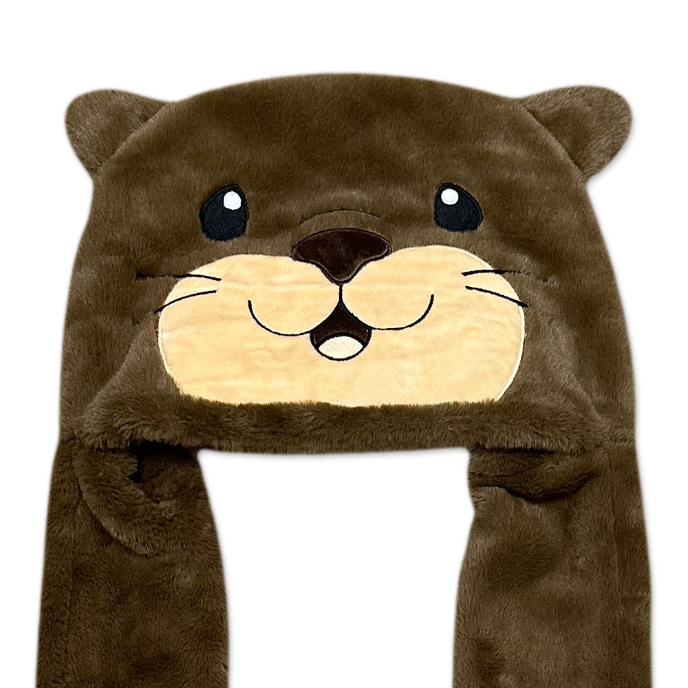 The Otter Longpaw Hat is a brown plush hat designed like an adorable otter's face, with round eyes, a beige snout, small ears, and long side flaps—perfect as a cozy winter hat for animal costume fans.