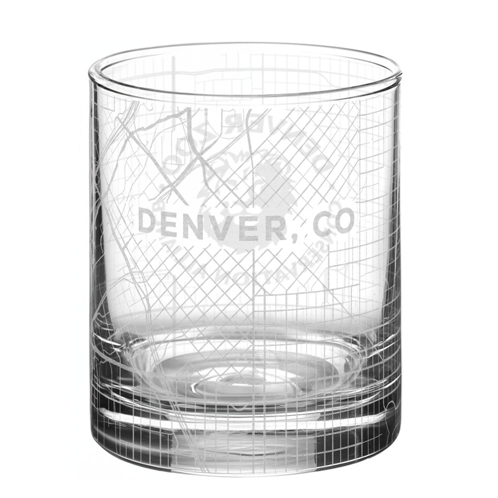 The DZCA Rocks Glass features a grid and map design with "DENVER, CO" etched in the center and a subtle DZCA logo—an eye-catching piece of glassware.