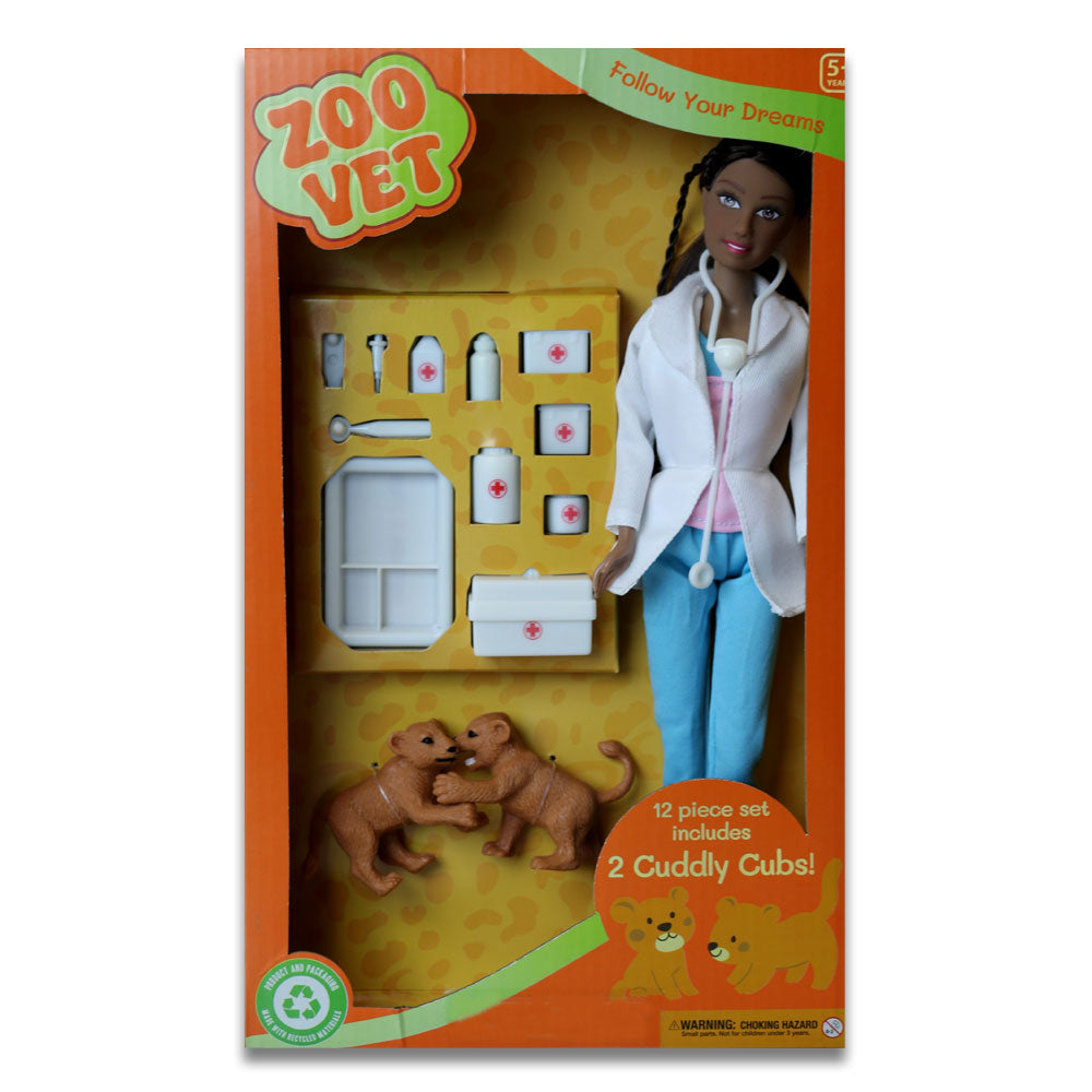 The Eco Zoo Vet Doll set includes an eco-friendly doll with stethoscope, two toy cubs, and vet accessories. The orange box features animal graphics and "Zoo Vet," perfect for aspiring zoo veterinarians.