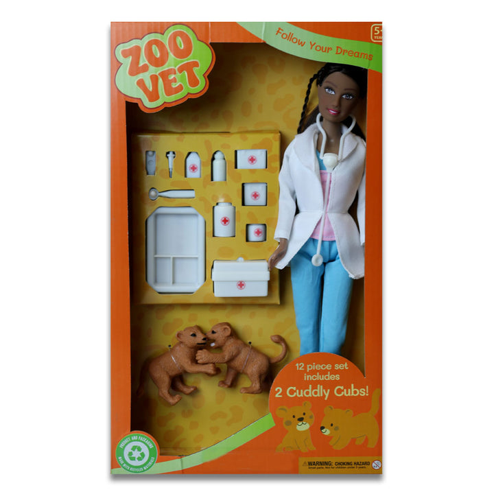 The Eco Zoo Vet Doll set includes an eco-friendly doll with stethoscope, two toy cubs, and vet accessories. The orange box features animal graphics and "Zoo Vet," perfect for aspiring zoo veterinarians.
