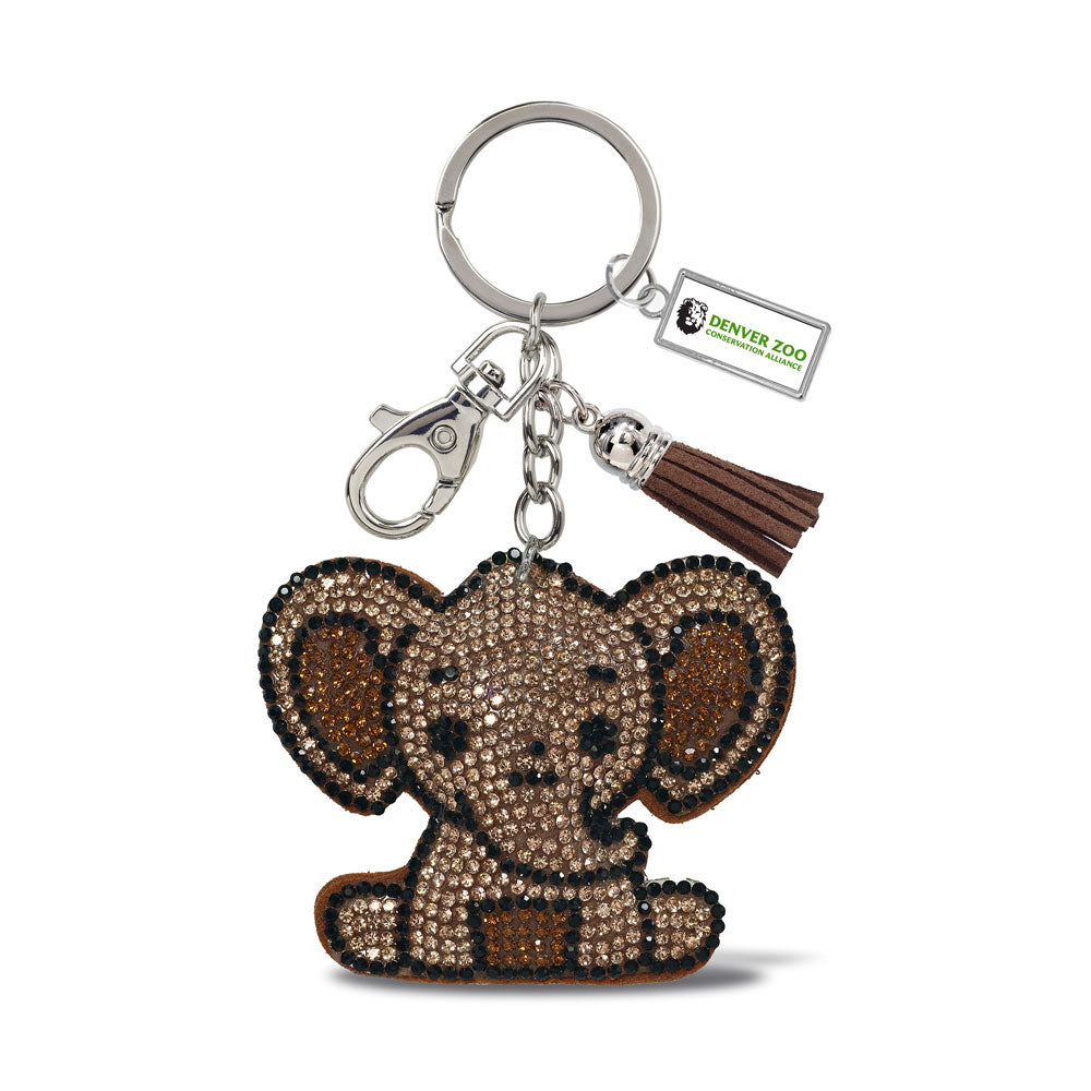 The DZCA Elephant Bling Keychain features rhinestones, a brown tassel, and a Denver Zoo logo tag on a sturdy metal ring and clasp—perfect for animal lovers supporting zoo conservation.