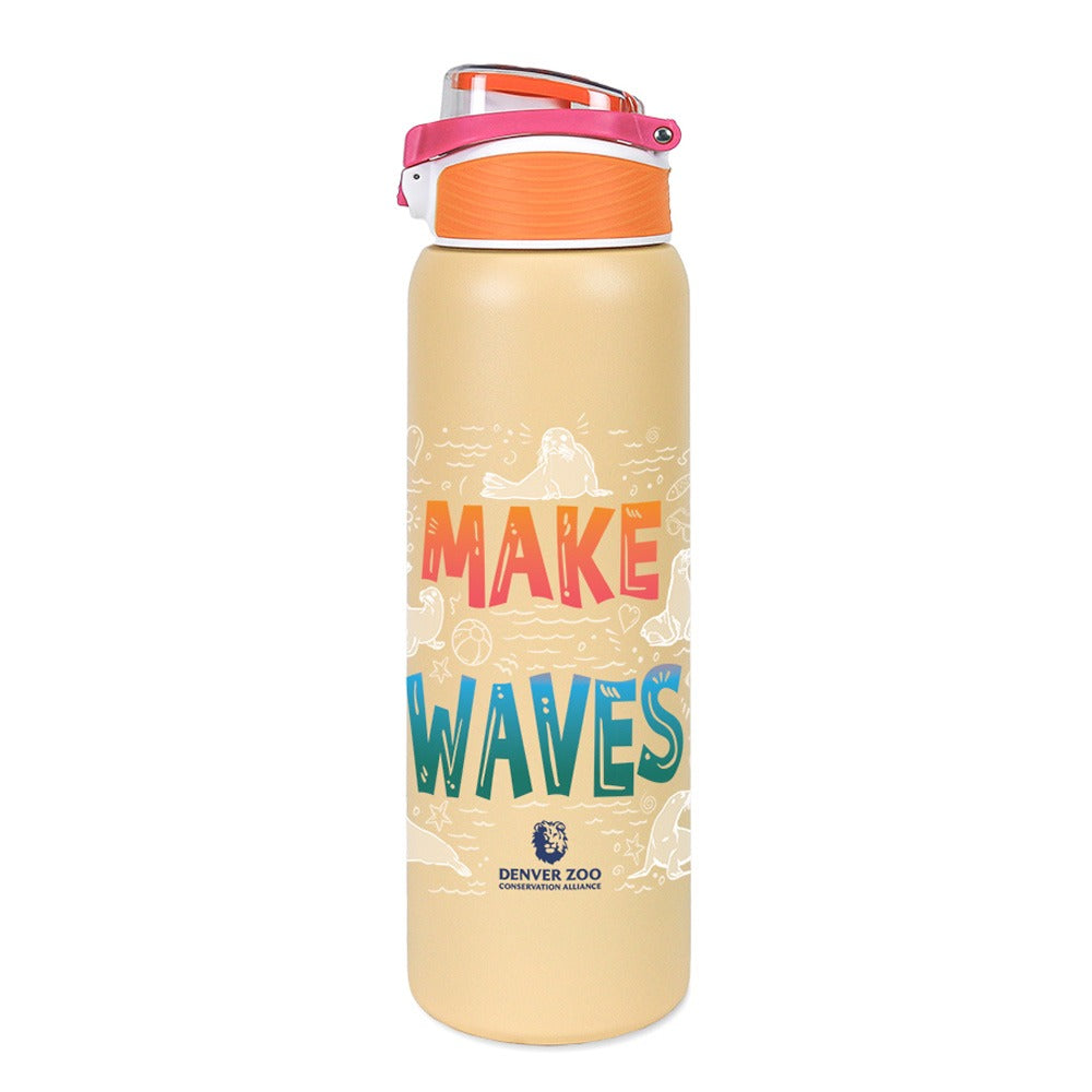 The DZCA Sea Lions Make Waves Water Bottle is beige with a pink and orange lid, bold MAKE WAVES lettering, small animal illustrations, and the Denver Zoo logo—an eye-catching conservation water bottle.