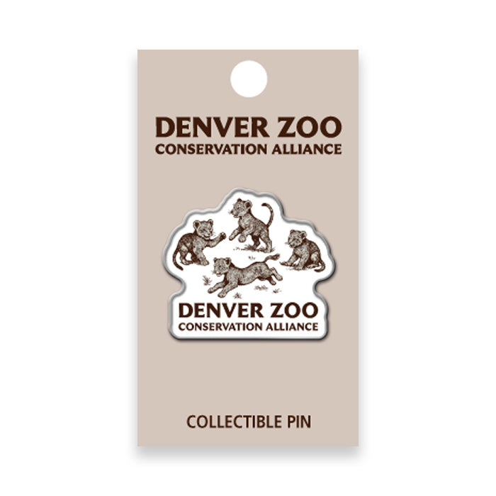 Show your support for wildlife conservation with the DZCA Lion Cub Lapel Pin, featuring playful African lion cub illustrations on a tan Denver Zoo Conservation Alliance card.