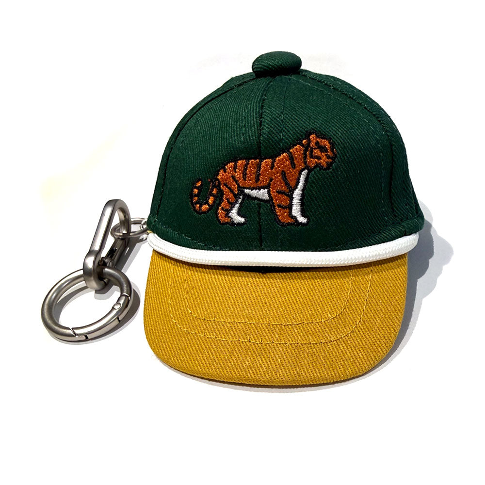 The Tiger Mini Cap Bag Clip is a small green and yellow keychain with a metal clasp, featuring an embroidered tiger on the front—an ideal wildlife-inspired accessory for your bag.