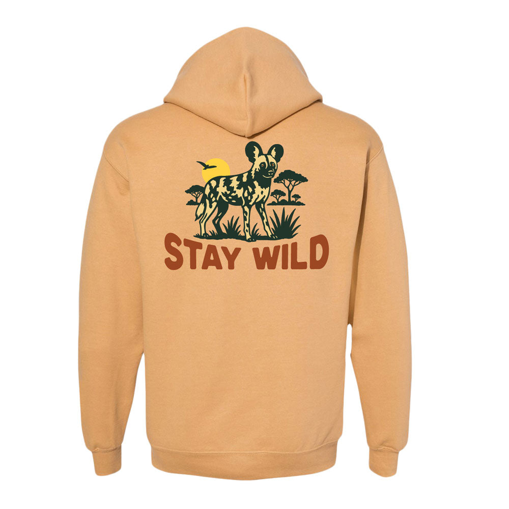 The DZCA Stay Wild Dogs Hooded Sweatshirt displays African Wild Dogs with a yellow sun and “STAY WILD” in bold brown below—a tan hoodie seen from the back, perfect for any nature enthusiast.