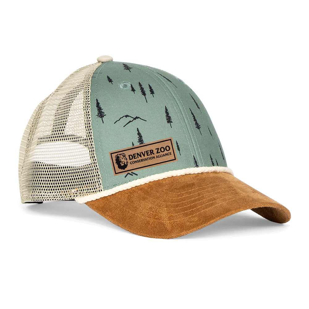 The DZCA x Jack and Sage Trees Cap features a tan suede brim, green front panels with a nature pattern, tan mesh back, and a Denver Zoo Conservation Alliance patch—perfect for outdoor adventure enthusiasts.