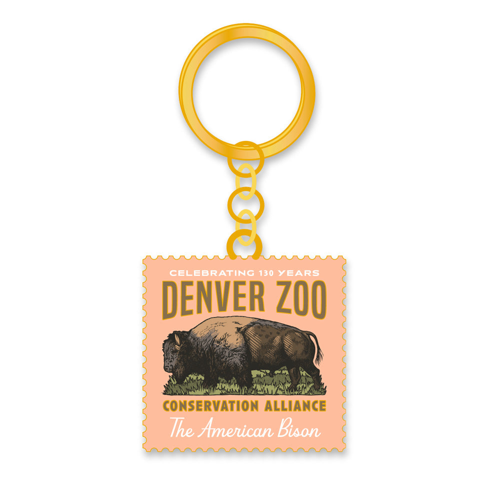 The DZCA 130th Anniversary Bison Keychain features a square pendant with an American bison illustration and "Denver Zoo Conservation Alliance Celebrating 130 Years"—a perfect Colorado souvenir and anniversary keepsake.