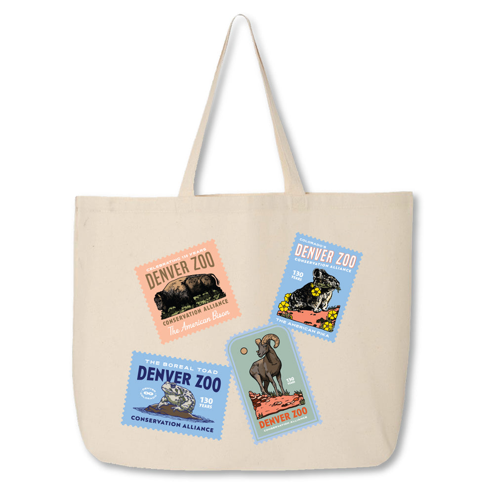 The DZCA 130th Anniversary Collage Tote is a beige Colorado tote with four vibrant Denver Zoo stamp-style animal designs—a bear, leopard, toad, and okapi—plus conservation and zoo-themed text. Perfect for celebrating the Zoo’s 130th anniversary!.