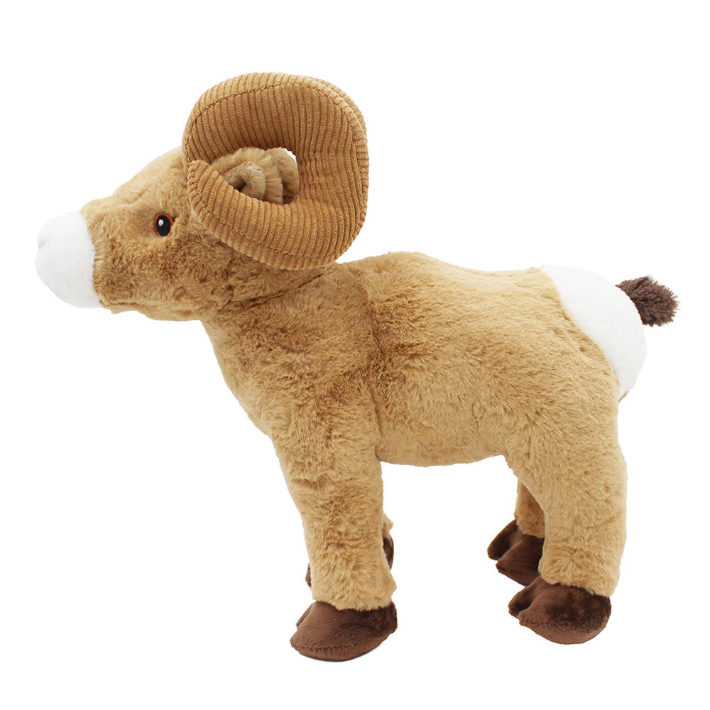 The Bighorn Sheep Plush is a cuddly companion with brown fur, dark hooves, curved corduroy horns, a white snout and tail with a dark tip, and stands proudly on all four legs—perfect for nature lovers.