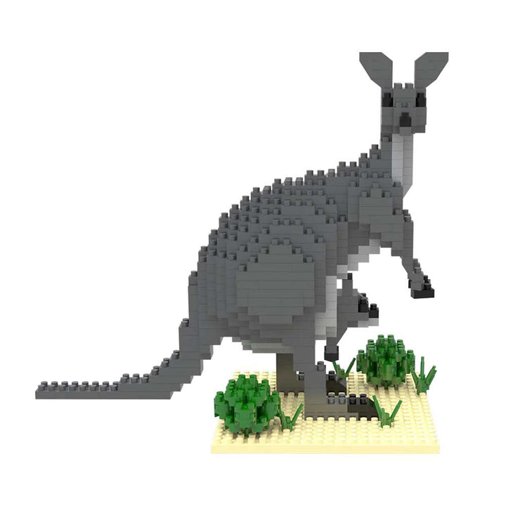 The Mini Building Blocks Kangaroo is a cute gray kangaroo with a joey in its pouch on a tan base with green LEGO plants—a portable set perfect for display or play.