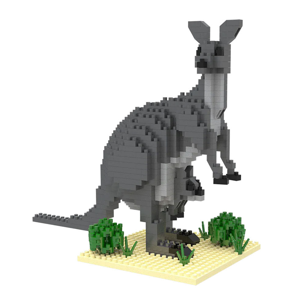 The Mini Building Blocks Kangaroo features a kangaroo with a joey in its pouch, standing on a yellow base with green plants—a fun, portable set for kangaroo lovers.