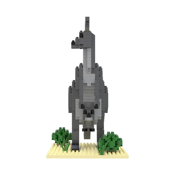 A blocky, gray kangaroo made from portable mini building blocks stands on a tan baseplate with green brick plants, viewed from the front against a white background.