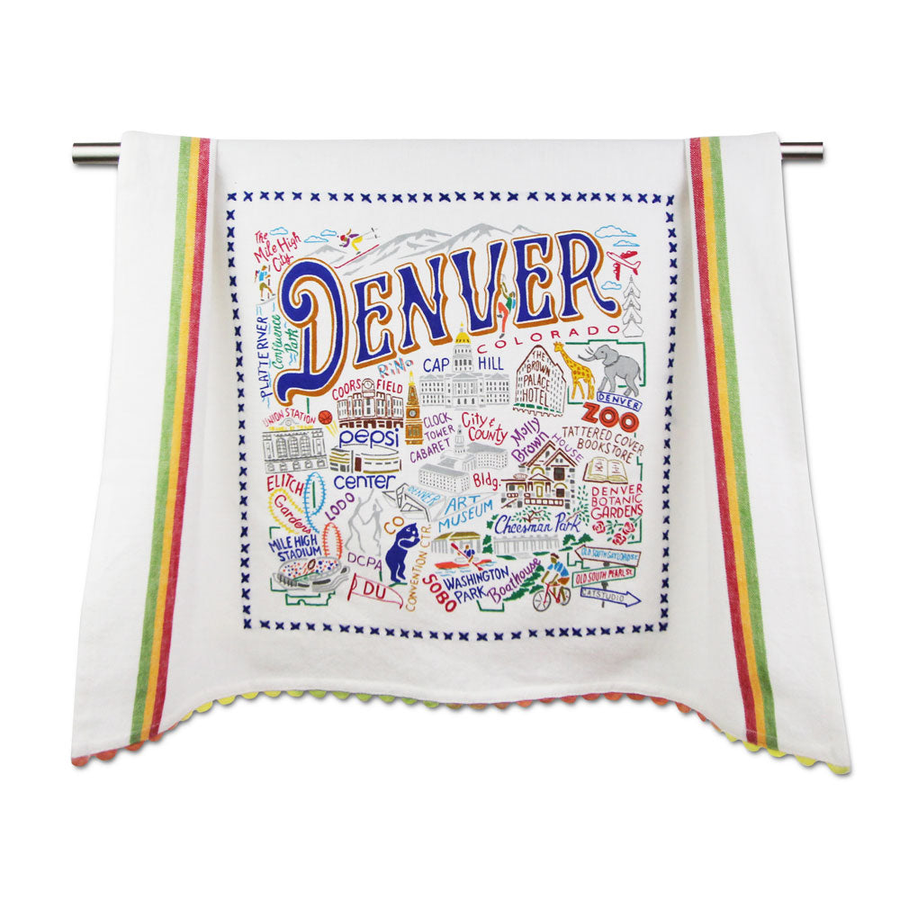 The Denver Dish Towel features hand-drawn Denver landmarks, a border with blue Xs, multicolored stripes, and scalloped edges—making it a vibrant and essential kitchen accessory.