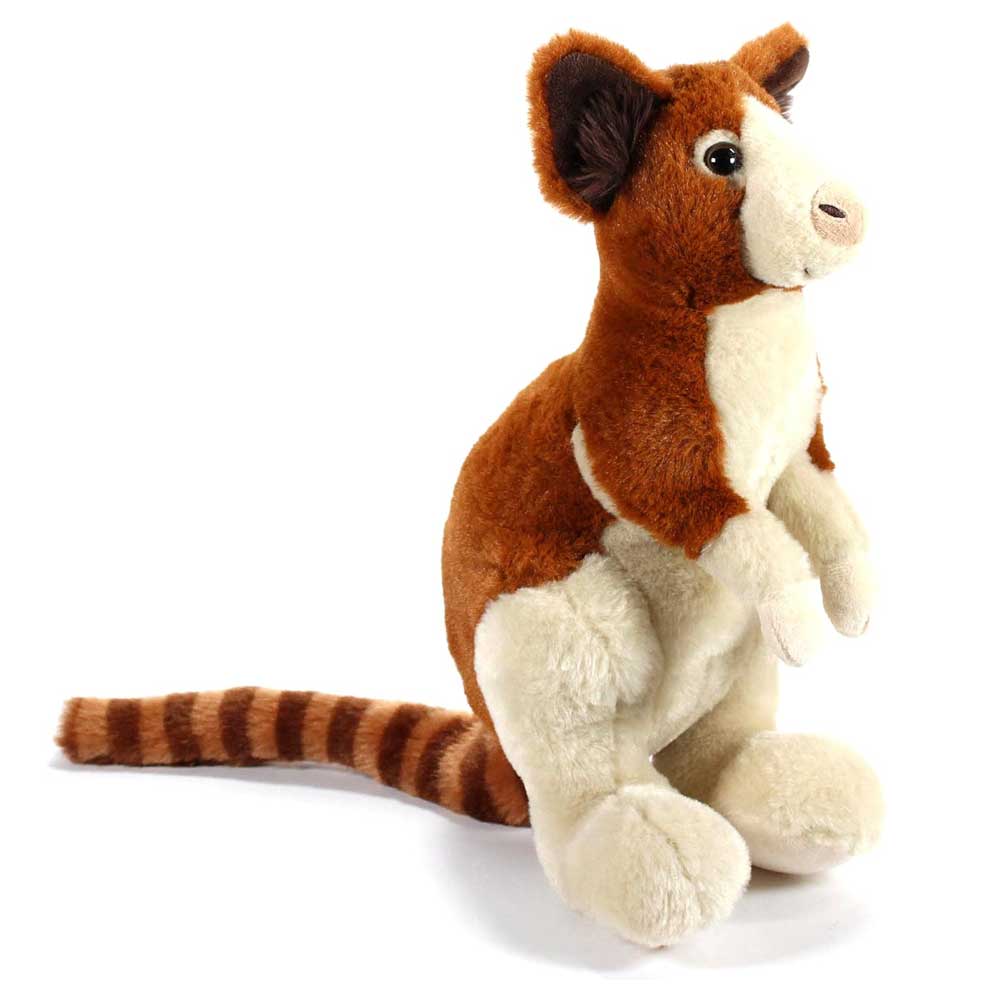 The Tree Kangaroo Plush is a cuddly stuffed animal with brown and cream fur, upright ears, large feet, and a long striped tail, sitting upright on a white background.