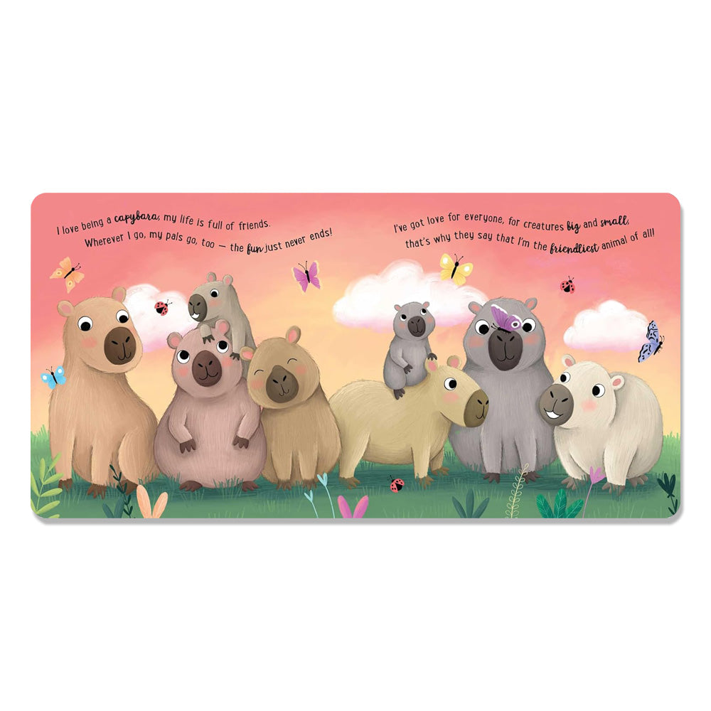 A vibrant scene from "I Love Being a Capybara: Padded Board Book" shows nine smiling capybaras, some with glasses or flowers, on grass with butterflies and ladybugs under a pink sky with cheerful clouds and playful text above.