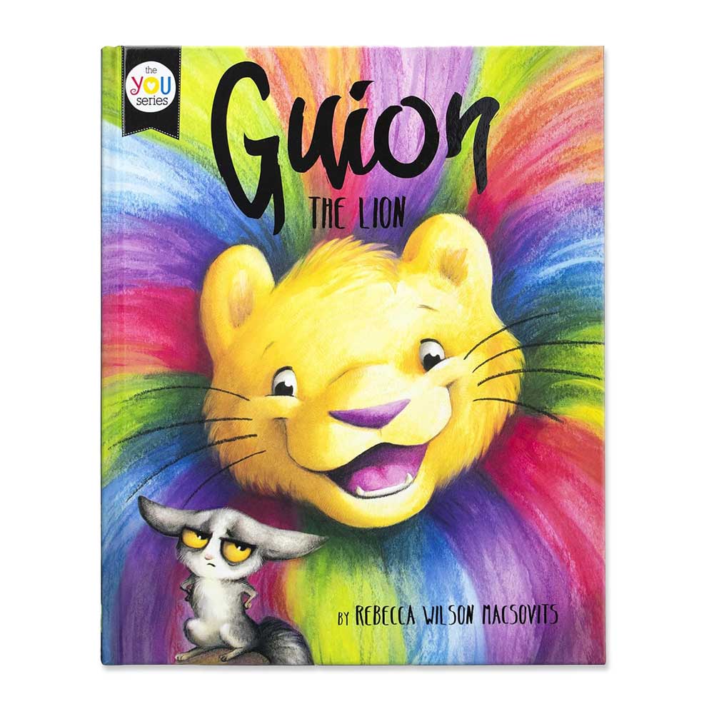 The cover of Guion The Lion features a smiling yellow lion with rainbow-like fur behind him and a grumpy gray cat, suggesting an imaginative adventure. The author is Rebecca Wilson Macsovits.