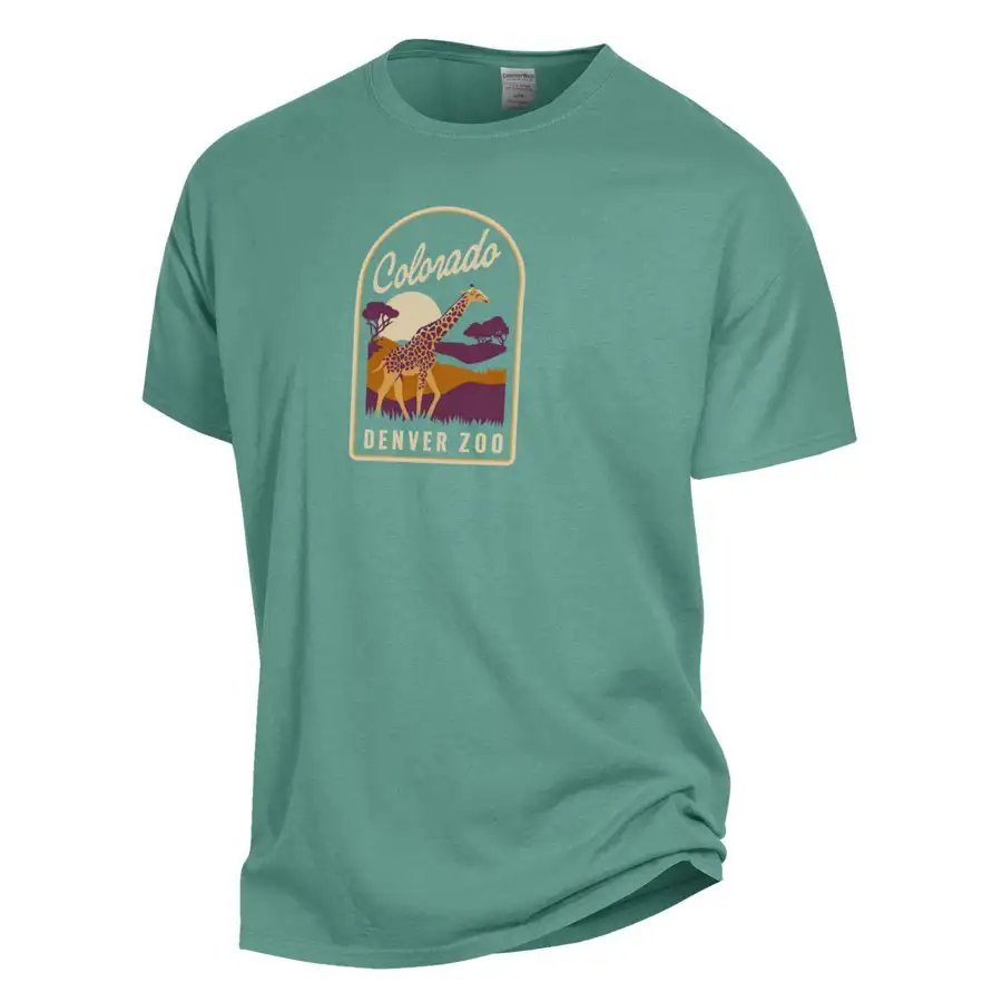 The Denver Zoo Giraffe Patch T-Shirt is a teal short-sleeve made of soft ringspun cotton, featuring a vibrant giraffe graphic with mountains and trees, plus "Colorado Denver Zoo" printed on the front.