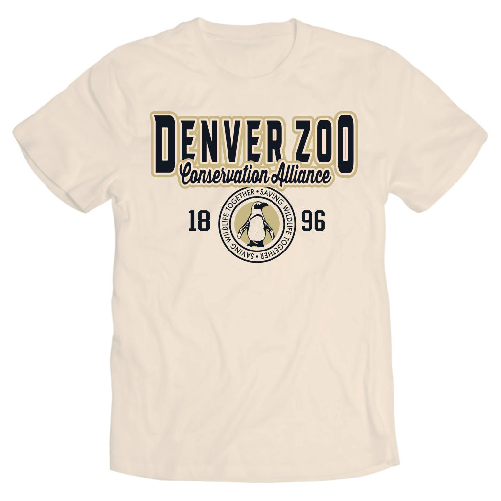The DZCA Collegiate Penguin T-Shirt is a beige tee with "Denver Zoo Conservation Alliance," the year 1896, and a circular African Penguin graphic plus "Saving Together" below the zoo’s name.