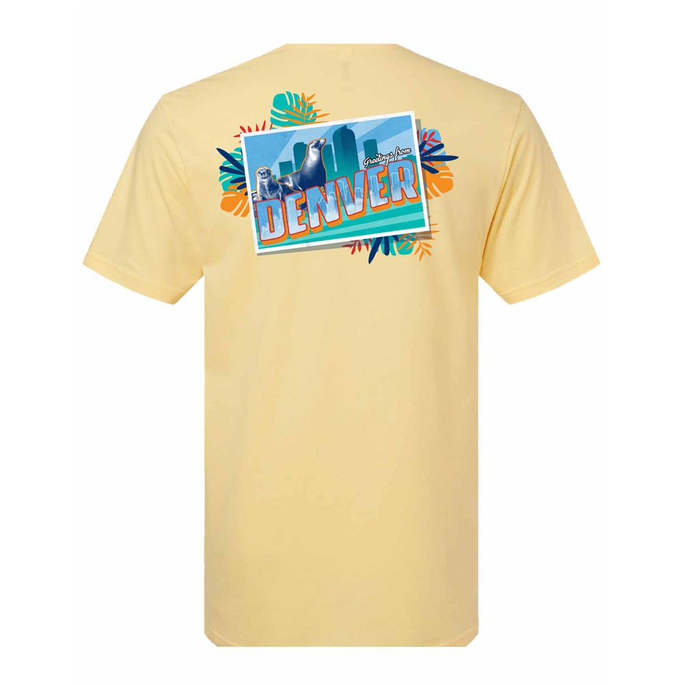 The DZCA Greetings from Denver T-Shirt is light yellow and features a colorful postcard-style DENVER graphic, city skyline, and bright leaves on the back—ideal for any zoo apparel fan.