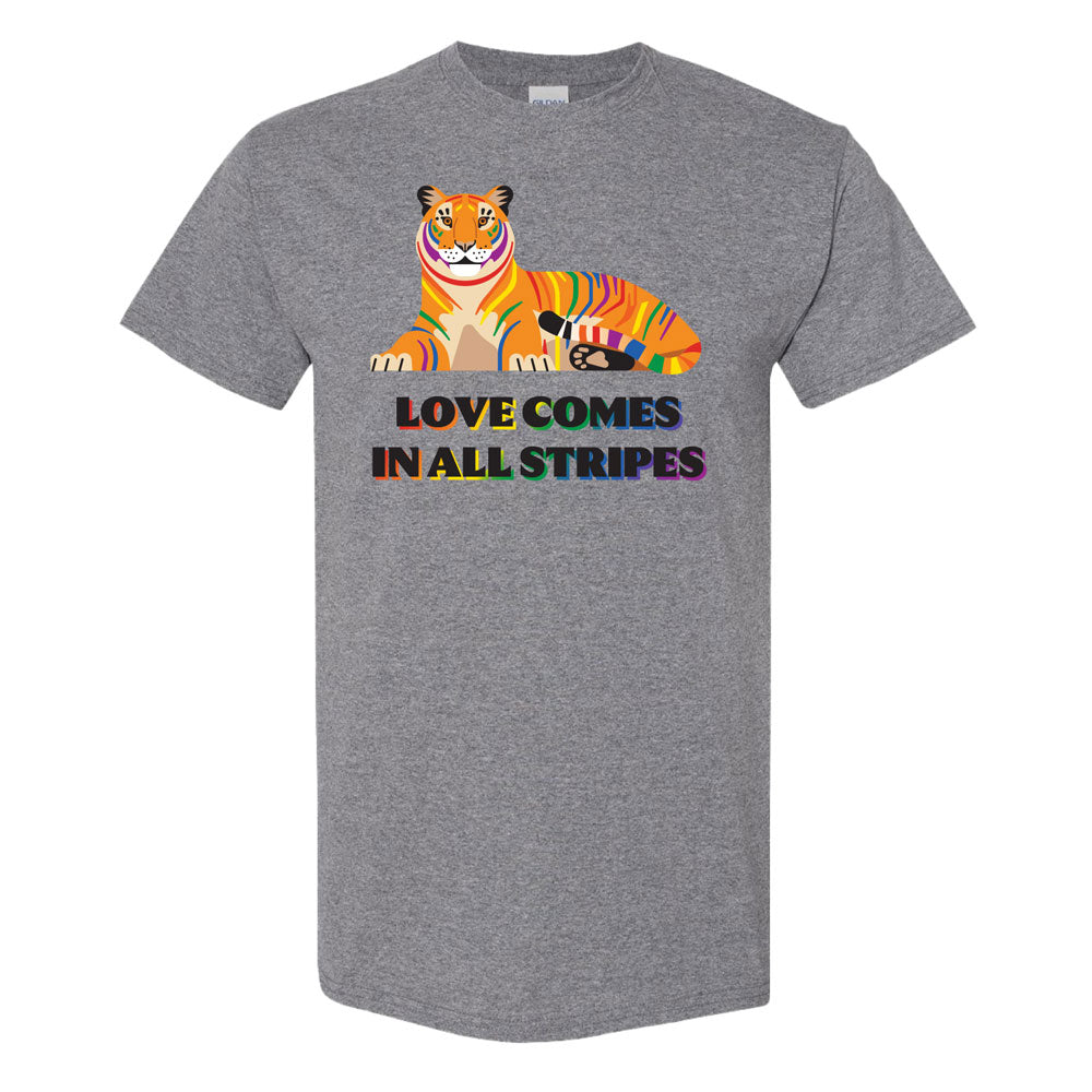 Show your DZCA style with the DZCA Tiger Pride T-Shirt—gray, unisex, classic fit, featuring a rainbow-striped tiger above “LOVE COMES IN ALL STRIPES” in colorful letters.