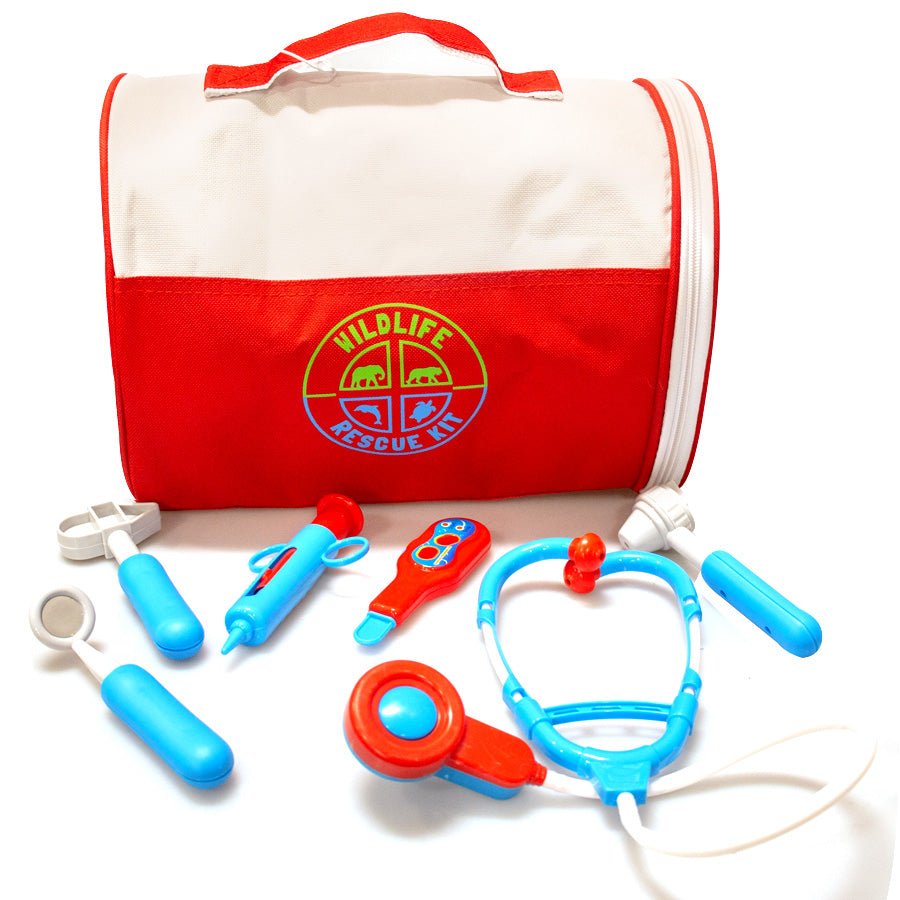 The Wildlife Rescue Kit includes a red and white bag surrounded by blue and red toy medical tools like a stethoscope, syringe, thermometer, tweezers, otoscope, bandage scissors, and a portable rescue crate—perfect for plush animals.
